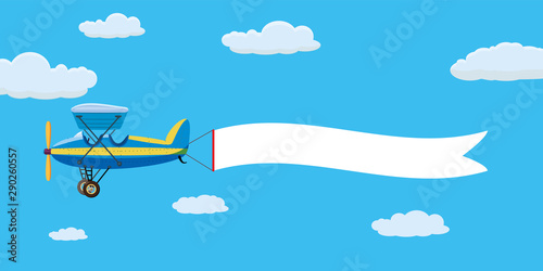 Red retro biplane aircraft pulling advertisement banner