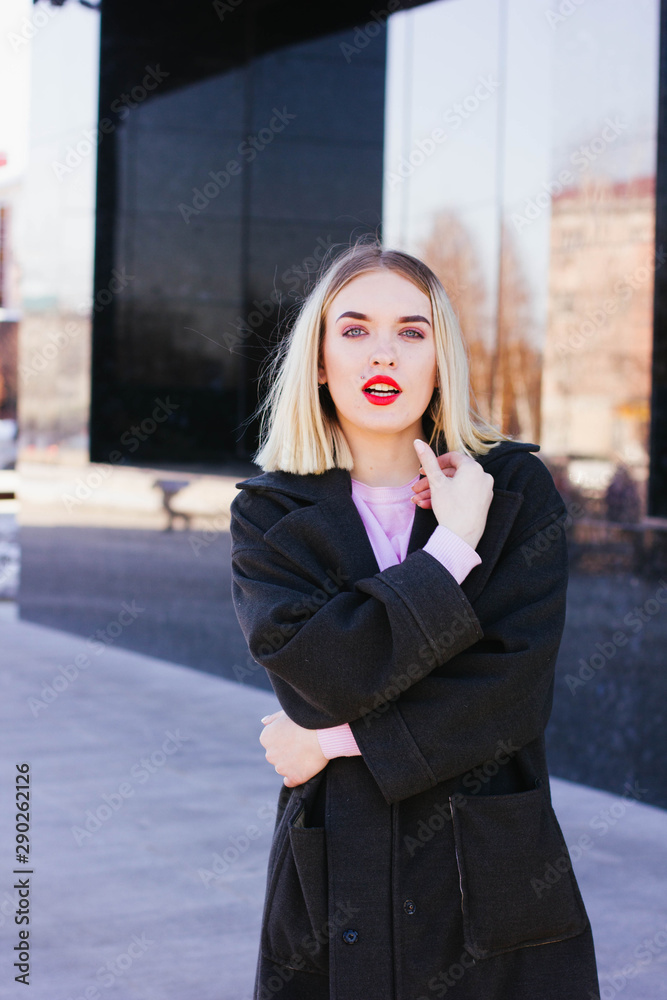 Fototapeta premium portrait of a blonde girl in a coat