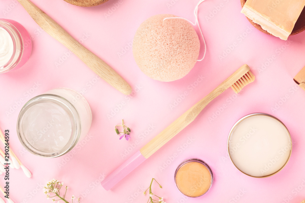 Plastic-free, zero waste cosmetics, flat lay on a pink background. Bamboo toothbrushes and cotton swabs, konjac sponge, natural organic products pattern Plastic-free, zero waste cosmetics, flat lay on a pink background. Bamboo toothbrushes and cotton swabs, konjac sponge, natural organic products pattern