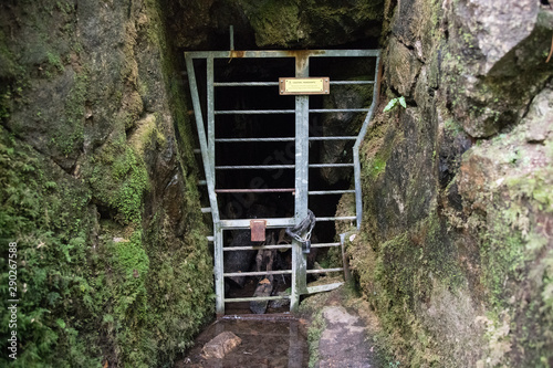 Locked metal gate to abandoned mineshaft