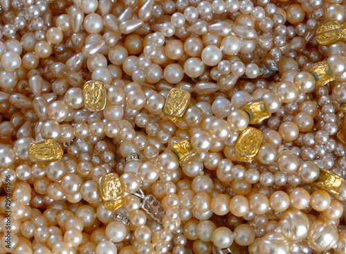 precious pearls top view closeup, shiny background
