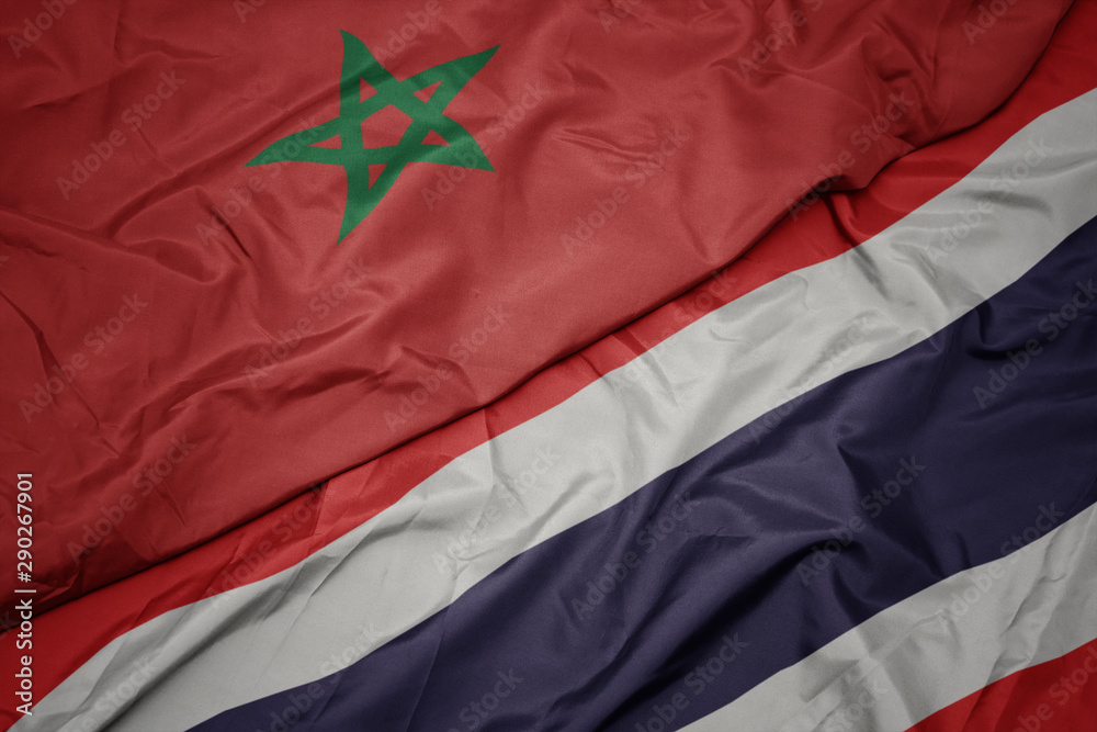 waving colorful flag of thailand and national flag of morocco. waving colorful flag of thailand and national flag of morocco.