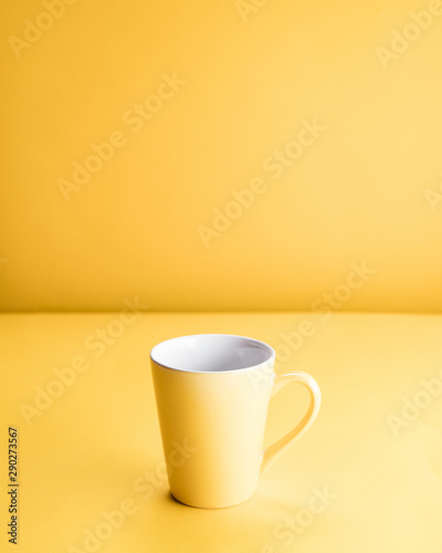Still life of a yellow mug