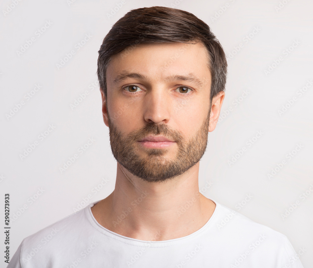 Portrait Of Man Looking At Camera Over White Background - obrazy, fototapety, plakaty 