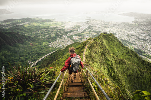 Dramatic views over Kaneohe hiking the Stairway to Heaven (Haiku Stairs) Oahu, Hawaii. photo