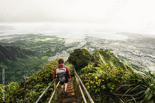 Dramatic views over Kaneohe hiking the Stairway to Heaven (Haiku Stairs) Oahu, Hawaii. photo