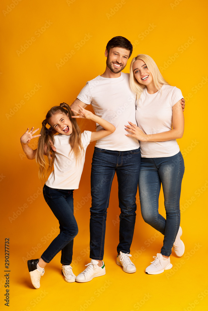 Cheerful Family Posing Having Fun In Studio, Full Length Cheerful Family Posing Having Fun In Studio, Full Length