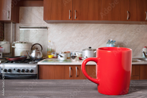 wooden surface and mug on the background of the kitchen