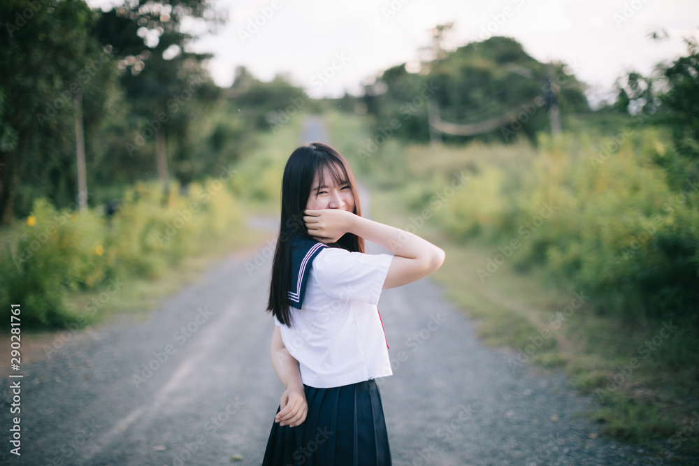 Portrait of asian japanese school girl costume looking at park outdoor film vintage style Portrait of asian japanese school girl costume looking at park outdoor film vintage style