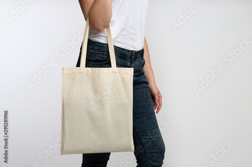 Unrecognizable Girl Holding Eco Bag Standing In Studio, Cropped
