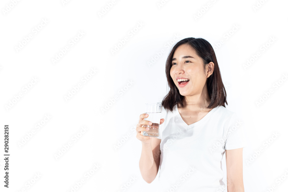 Young girl carry and drink water from a glass Young girl carry and drink water from a glass