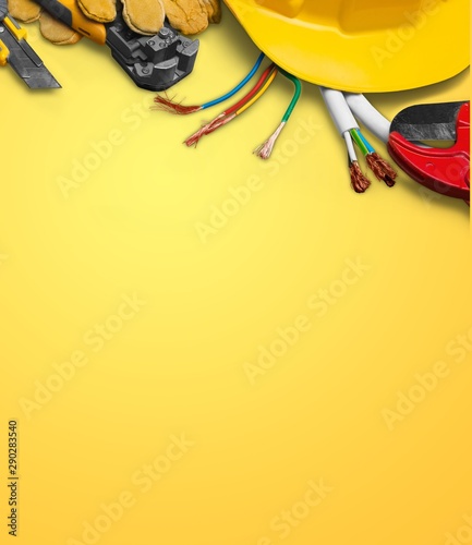 Yellow hard hat and leather work gloves