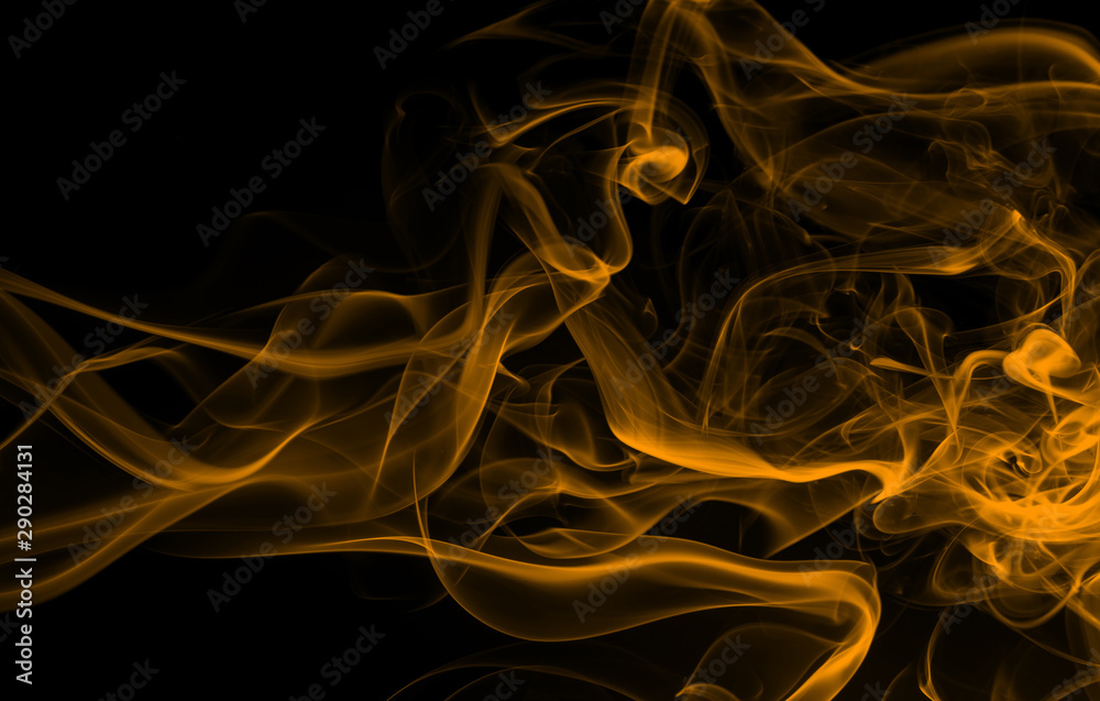 Yellow smoke abstract on dark background