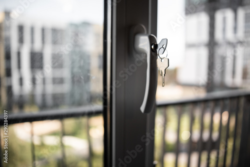 key in the handle of plastic window