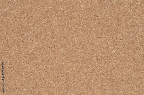 Corkboard background. Brown paper texture. Abstract pattern. Wood backdrop. Cardboard wall. Plywood.
