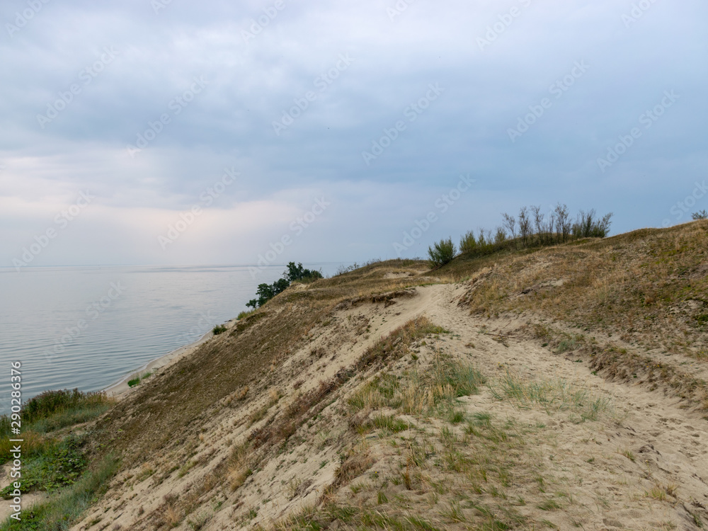 panoramic sea view in the distance, dunes in the foreground