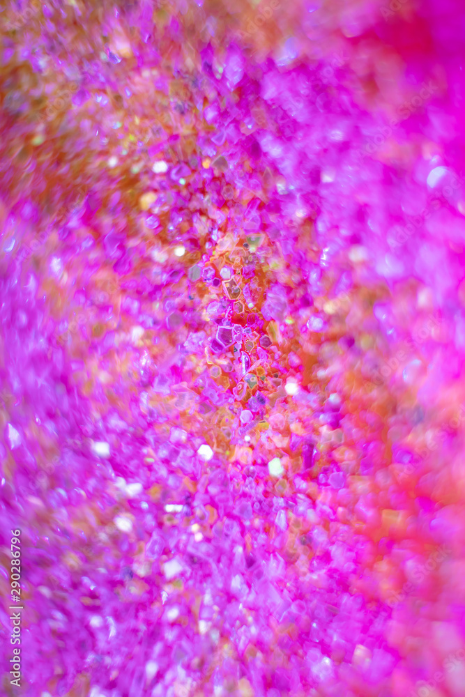 Christmas festive disco background - colorful sparkles close-up in a trendy neon light. Macro photo. Abstract bright image. The concept of holidays, parties. Christmas festive disco background - colorful sparkles close-up in a trendy neon light. Macro photo. Abstract bright image. The concept of holidays, parties.