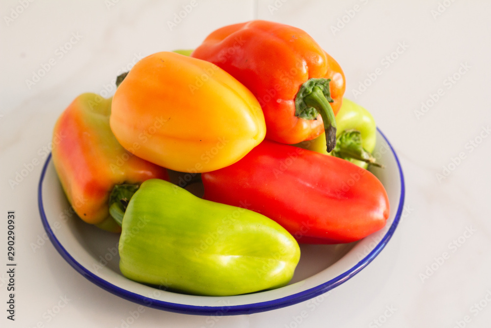peppers on a plate isolated on white peppers on a plate isolated on white