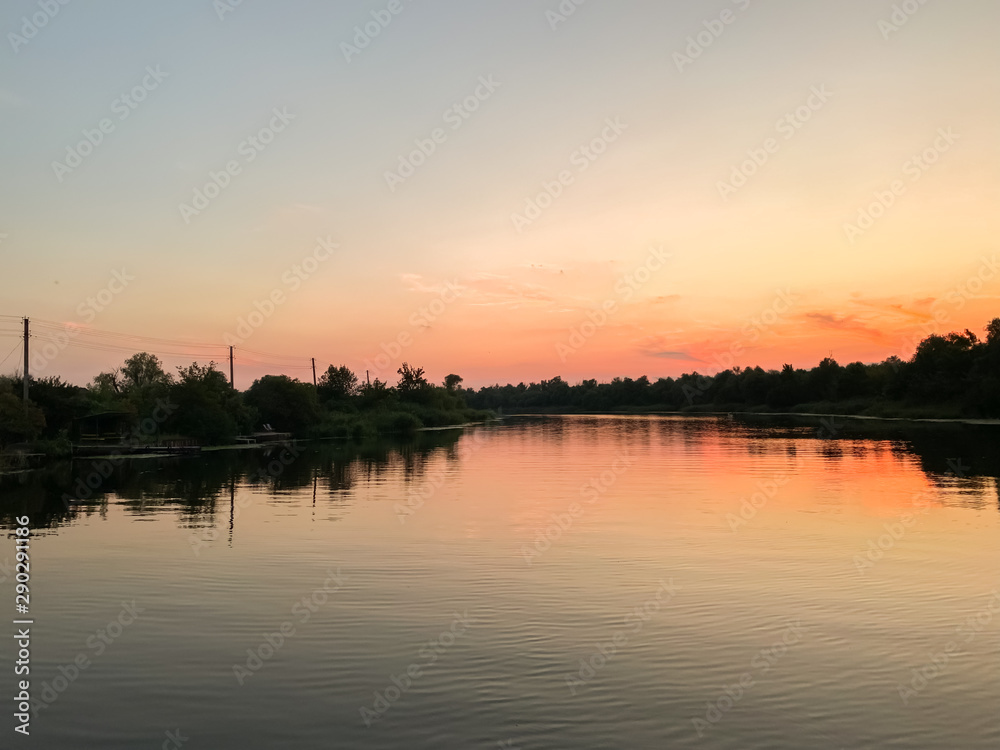 Beautiful summer sunset on the Dnipro river. Kherson, Ukraine. Landscape