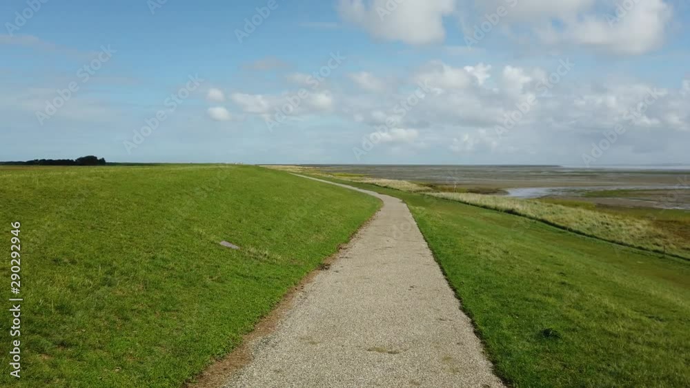 Dike at island Schiermonnikoog in the Netherlands, POV driving through Dike at island Schiermonnikoog in the Netherlands, POV driving through