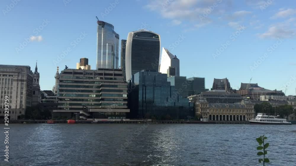 London, UK - Aug 20th 2019: London city cityscape skyline and financial district 'square mile' travel footage bridge view Thames river London, England, UK footage film video landmark stock London, UK - Aug 20th 2019: London city cityscape skyline and financial district 'square mile' travel footage bridge view Thames river London, England, UK footage film video landmark stock