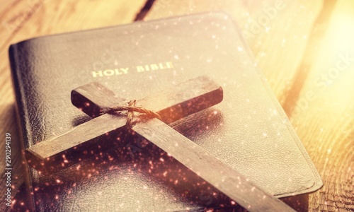 Holy Bible book and cross, close-up view