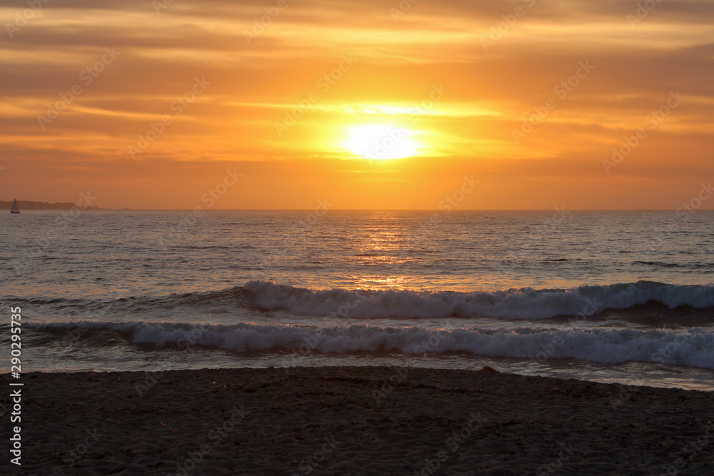 View of the sun about to set from Sand City Beach, California, USA