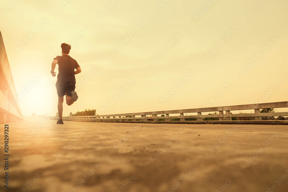 The man jogging in the evening for good health - obrazy, fototapety, plakaty 