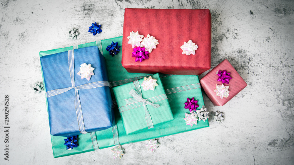 Christmas present boxes on a light marble background