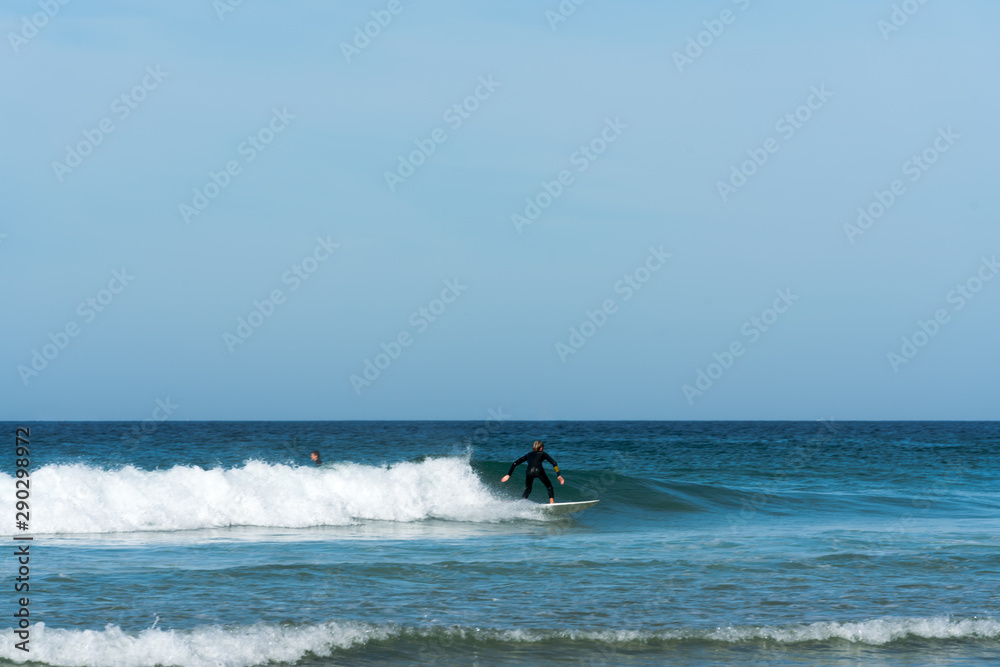 teenager surfing on the west coast of Brittany in France at Toulinguet Beach near Camaret-Sur-Mer teenager surfing on the west coast of Brittany in France at Toulinguet Beach near Camaret-Sur-Mer