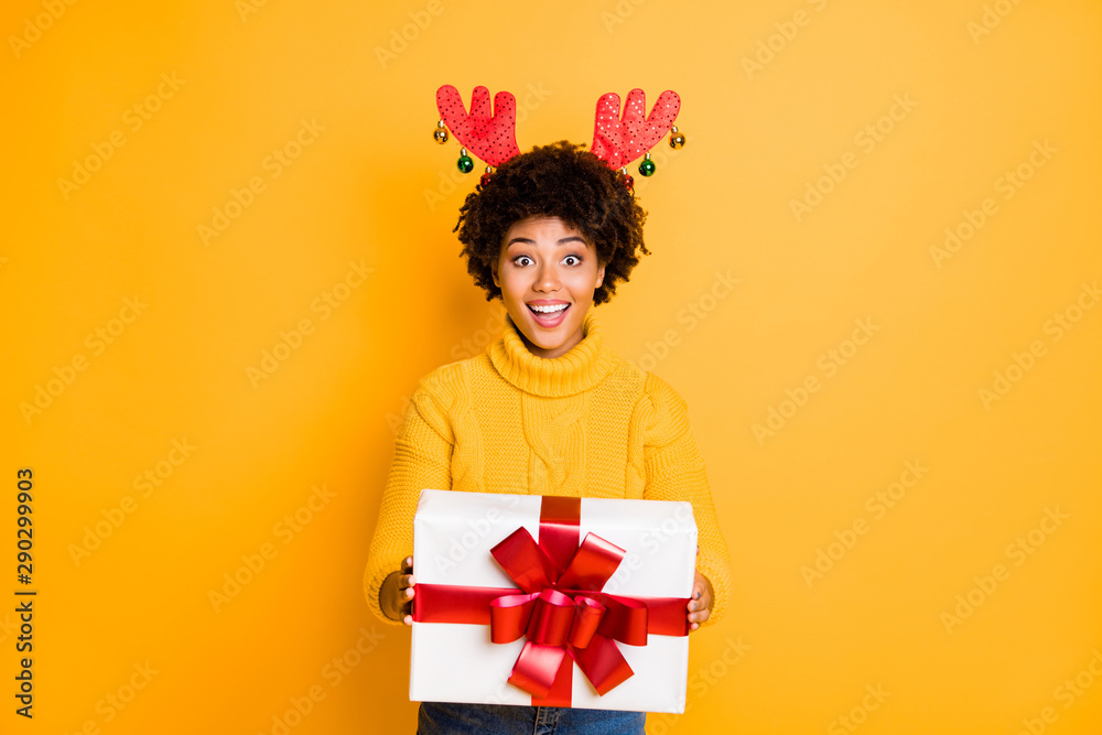 Its for you Santa helper giving package concept. Photo of pretty funny funky glad positive excited with toothy smile girl holding big white giftbox in hands isolated vivid color background Its for you Santa helper giving package concept. Photo of pretty funny funky glad positive excited with toothy smile girl holding big white giftbox in hands isolated vivid color background