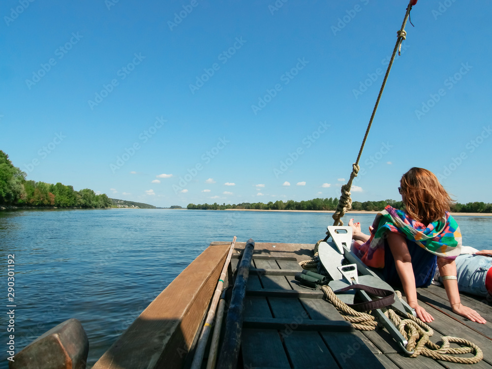 girl stern of a pleasure boat during a boat trip