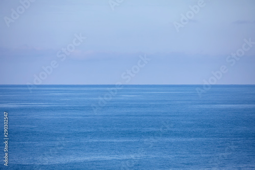 View of the ocean. Blue water background showing the horizon and sky 
