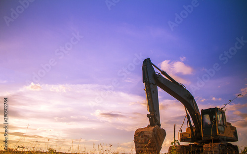 yellow excavator at work