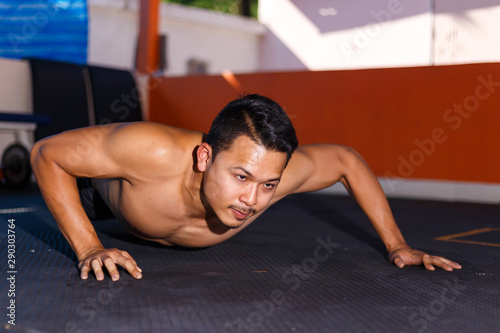 Man try to push up exercise for chest workout at home fitness.