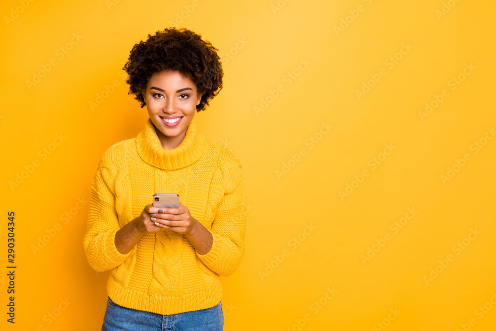 Copyspace photo of attractive cheerful nice charming cute girlfriend smiling toothily wearing jeans denim pullover holding telephone with her hands while isolated with vivid color background Copyspace photo of attractive cheerful nice charming cute girlfriend smiling toothily wearing jeans denim pullover holding telephone with her hands while isolated with vivid color background