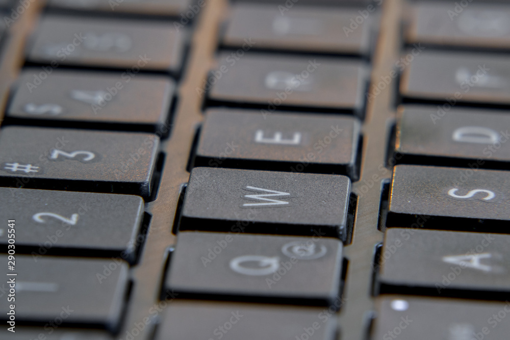Black laptop keyboard. Image in escape of keys with a fixed point and out of focus. Black laptop keyboard. Image in escape of keys with a fixed point and out of focus.