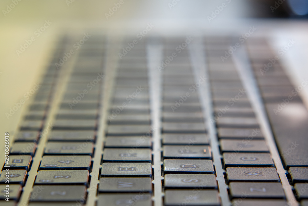 Black laptop keyboard. Image in escape of keys with a fixed point and out of focus. Black laptop keyboard. Image in escape of keys with a fixed point and out of focus.
