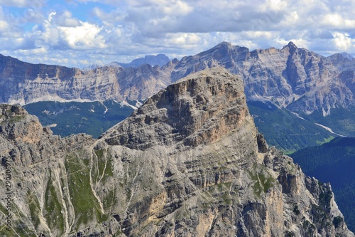 Beautiful view of Dolomites nearby Sass da Ciampac, Jëuf de Crespëina, Furcela de Ciampëi. Sunny day, blue sky, white clouds. Italy.