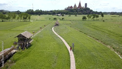 4K Aerial shot of Tuum Sua temple (Tiger Cave temple), most popular temple in Kanchanaburi , Thailand. photo