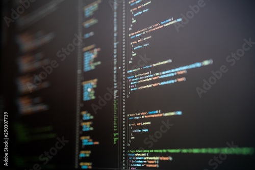 Picture of code on a computer screen in an IDE with black background with coloured text. Featuring Java Script and CSS.