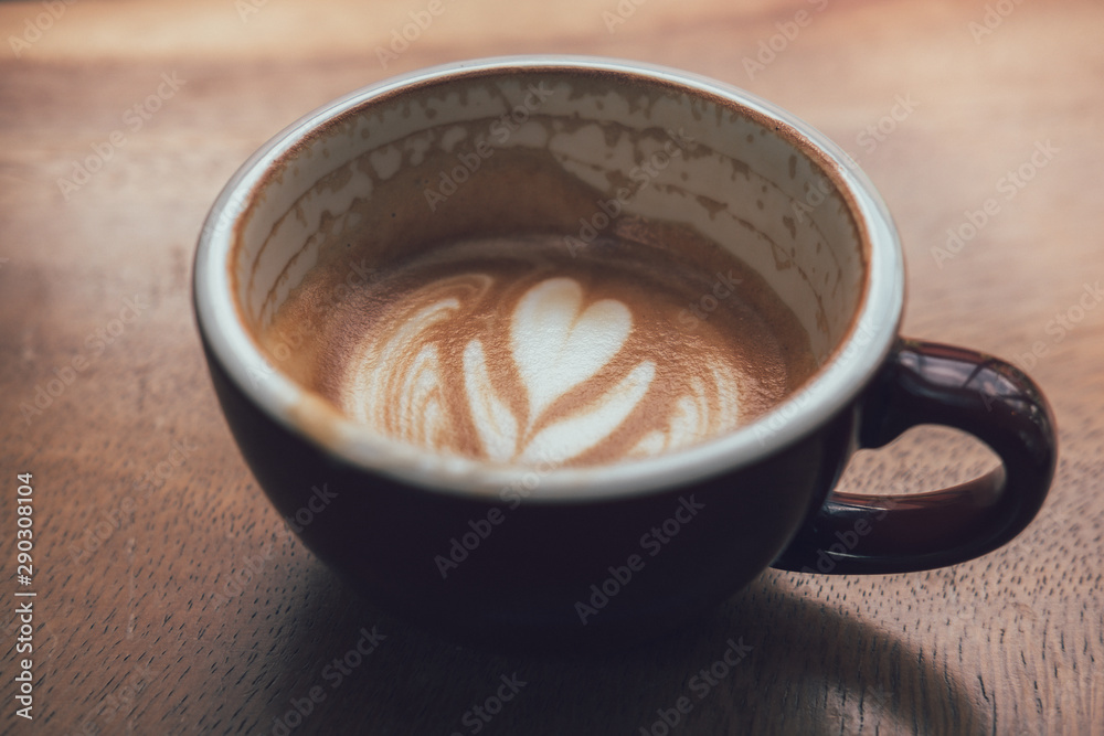 close-up coffee latte on the wood table. close-up coffee latte on the wood table.