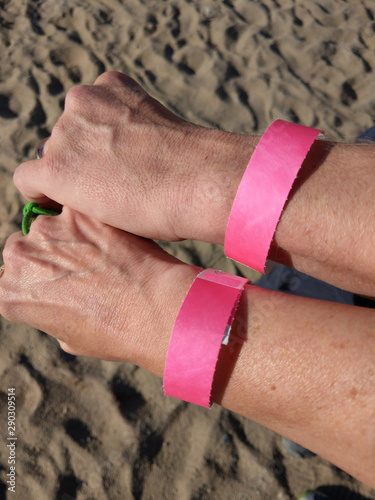 A man and a woman wearing wrist bands