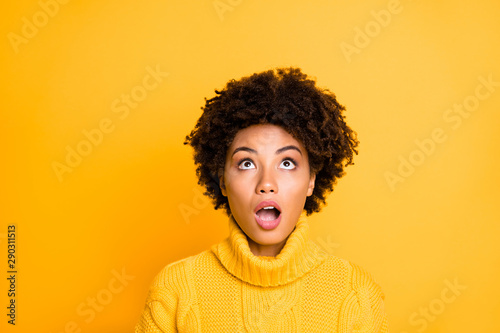 Photo of dark skin lady watch big shopping prices sorry for losing sale season wear warm knitted sweater isolated yellow background © deagreez