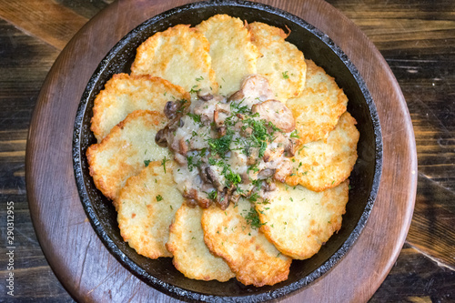 fried potato pancakes on a frying pan