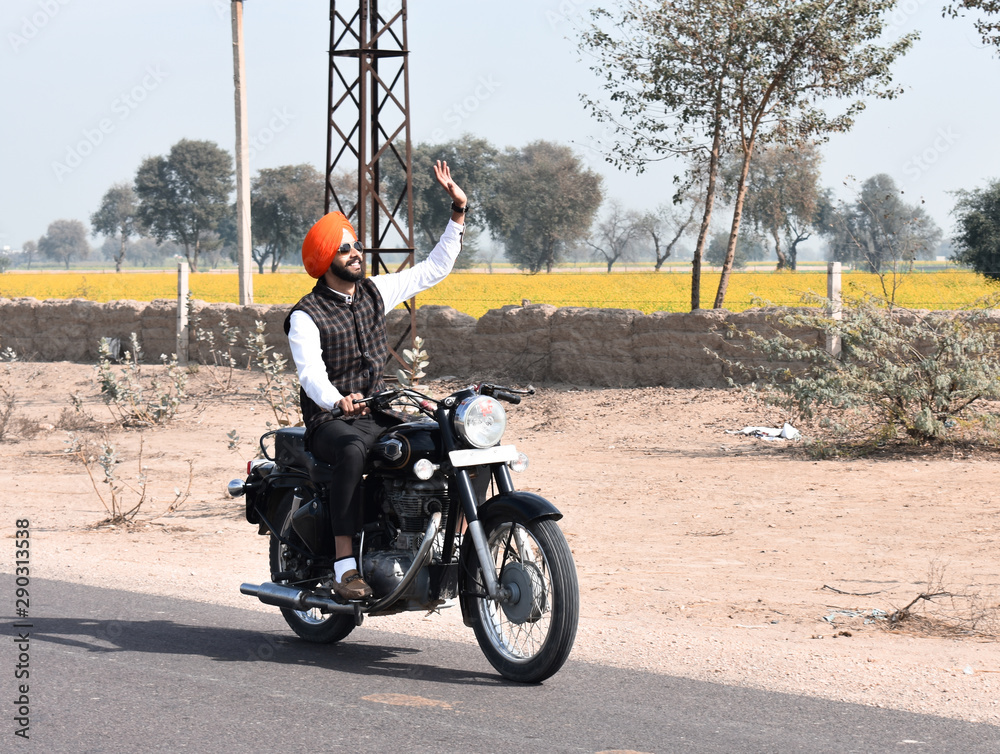 An Indian Punjabi boy ride bullet bike in village Stock Photo Adobe Stock