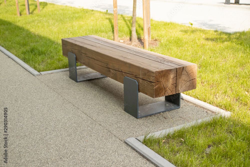 Street wooden bench in perspective, bench in the park