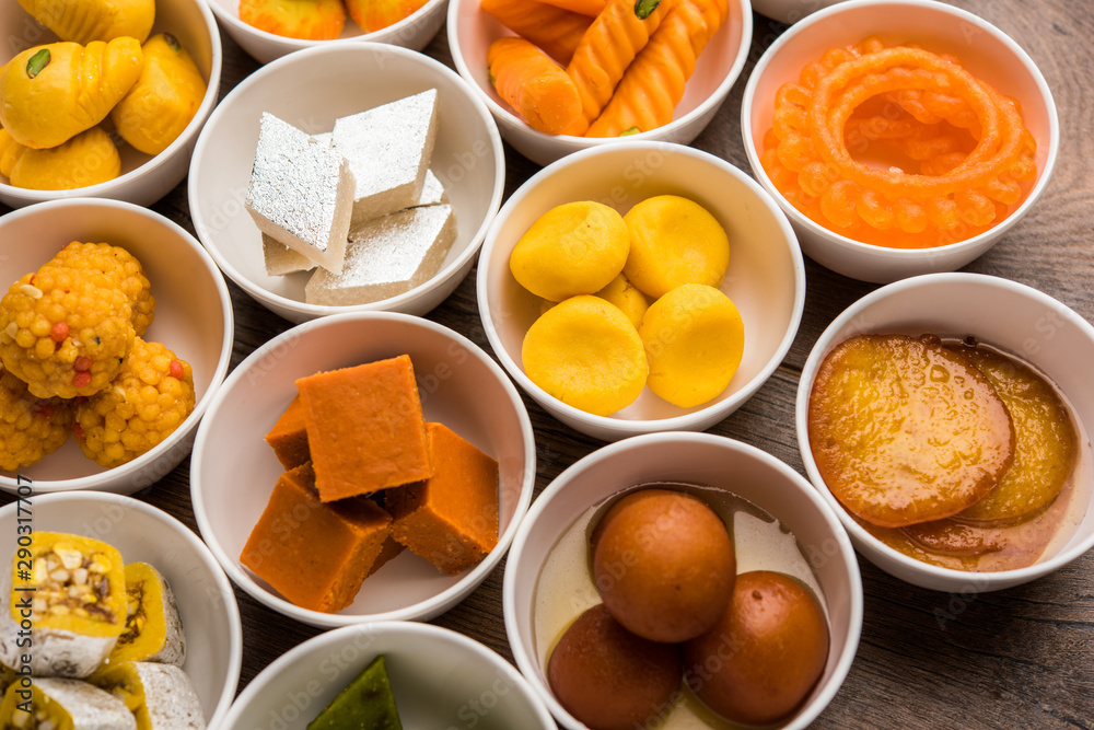 Rangoli of Assorted Indian sweets/mithai in bowl for Diwali or any other festivals, selective focus Rangoli of Assorted Indian sweets/mithai in bowl for Diwali or any other festivals, selective focus