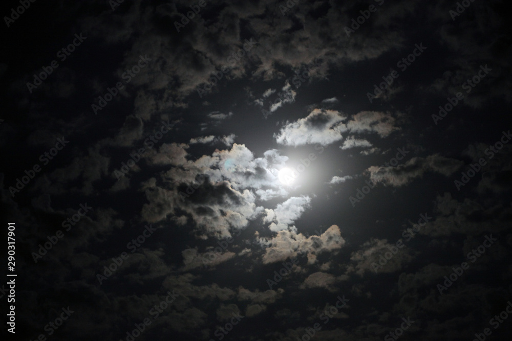 Black night sky with moon and clouds. Nature background. Black night sky with moon and clouds. Nature background.