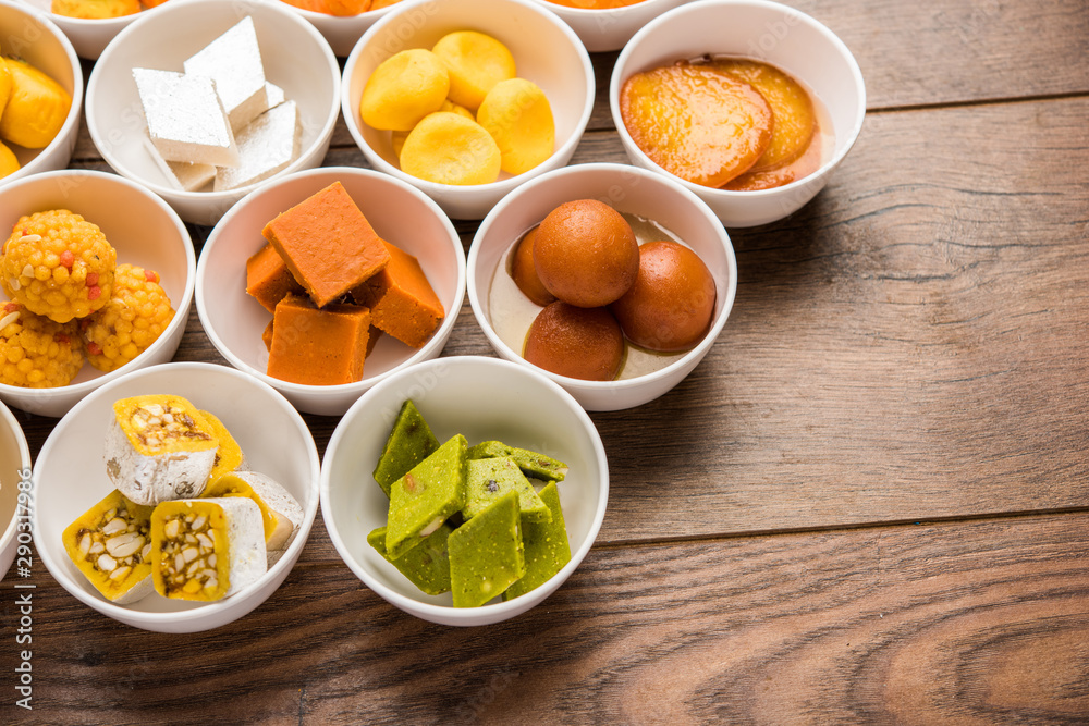 Rangoli of Assorted Indian sweets/mithai in bowl for Diwali or any other festivals, selective focus Rangoli of Assorted Indian sweets/mithai in bowl for Diwali or any other festivals, selective focus